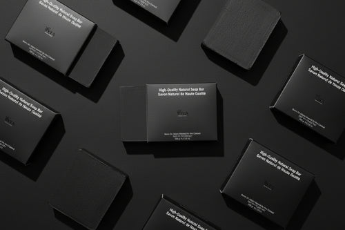 Black soap bar with packaging labeled 'High-Quality Natural Soap Bar' by VYTA on a white background.